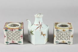 TWO PIERCED OPENWORK PORCELAIN SQUARE-FORM POTS, together with a porcelain hexagonal lidded water