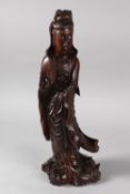 A CHINESE CARVED HARDWOOD FIGURE OF GUANYIN, 40cm high.