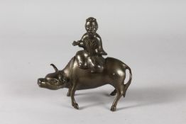 A CHINESE BRONZE INCENSE BURNER FORMED AS A BOY AND WATER BUFFALO, 15cm long.