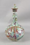 A CHINESE CANTON FAMILLE ROSE PORCELAIN LIDDED VASE, painted with panels of figures as well as