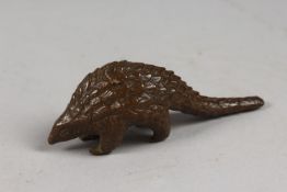 A BRONZE OKIMONO OF A PANGOLIN.
