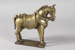 AN INDIAN BRASS FIGURE OF A HORSE, 19cm long.