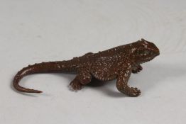 A BRONZE OKIMONO OF A LIZARD.