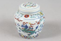 A CHINESE DOUCAI PORCELAIN POT AND COVER, 10cm high.