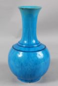 A CHINESE BLUE GLAZED SGRAFFITO PORCELAIN VASE, with incised floral motif decoration, the base
