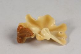 A CHINESE SOAPSTONE CARVING OF A FROG ON A LEAF, 8cm long.