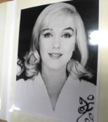 [FILM STARS] An album containing 65 publicity photographs in colour and black and white of film