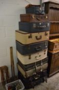 A large quantity of vintage and later suitcases.