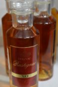 Five small 100ml bottles of cognac.