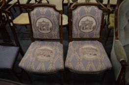 A pair of French style walnut framed side chairs with upholstered backs and seats in a classical