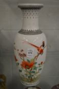 A Republican style vase decorated with birds and flowers.