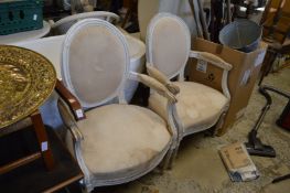 Two French style armchairs with white painted frames.