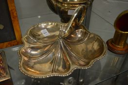 A silver plated shell shaped nut dish.
