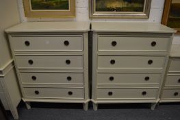 A good pair of cream painted four drawer chests.