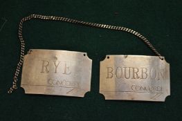 Two silver Concorde decanter labels, Bourbon and Rye.