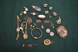 A collection of gold and other jewellery to include a morning brooch, cocktail watches, rings,