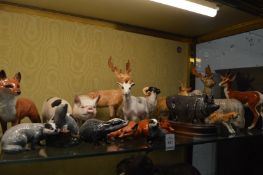 A collection of Beswick and other animals to include deer, pigs, badgers, foxes etc.
