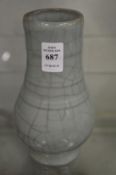 A Chinese celadon crackle glazed vase.