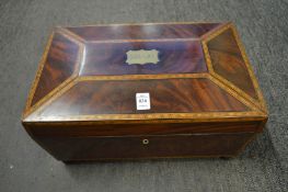 A good large Edwardian sarcophagus shaped mahogany sewing box.