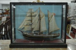 A model of a sailing ship in a display case.