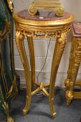 A pair of gilt wood and marble top circular jardiniere stands.