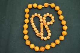 Two amber bead necklaces.