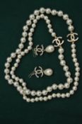 Decorative pearl necklace and matching earrings.