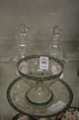A good engraved glass pedestal bowl and stand together with a pair of small cut glass bottles.