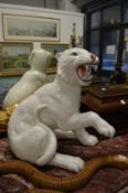 A large white glazed pottery model of a tiger.