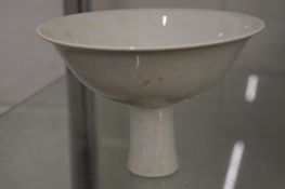 A Chinese blanc de chine stem cup.