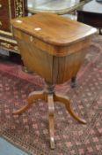 A Victorian walnut pedestal sewing table/work box.