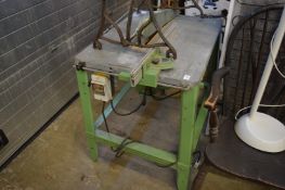 A floor standing circular table saw.