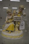Augustus Rex porcelain group of two children.