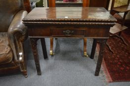 A Chippendale period mahogany rectangular fold-over combination card/tea table.