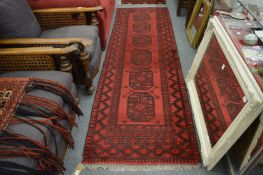 A Persian style bokhara type runner, 276cm x 85cm.