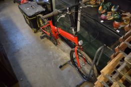 A folding bike with stand.