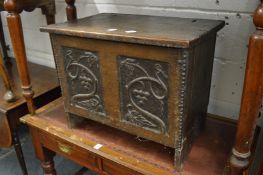 A good small 18th century oak coffer with later carved decoration.