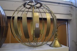 A large stylish metal ceiling light.