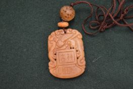 A Chinese carved jade pendant.