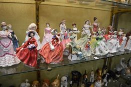 A collection of Royal Doulton and other figurines.