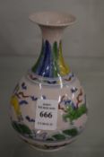 A small Chinese Doucai style bottle vase.