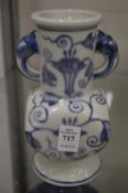 A Chinese blue and white vase with ring handles.