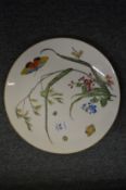 A Minton cabinet plate decorative with insects and flowers.