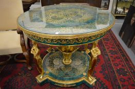 A large and impressive faux malachite and ormolu circular centre table.