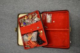 A jewellery case and contents.
