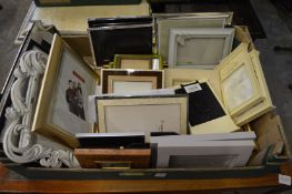 A quantity of decorative photograph frames.