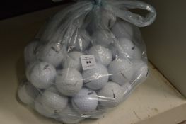 A quantity of golf balls.
