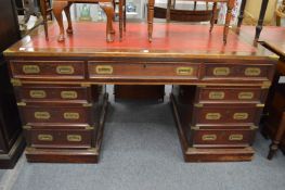 A military style mahogany twin pedestal partners desk.