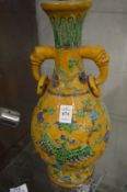 A good large Chinese twin handled vase with incised decoration.