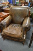 A good pair of leather upholstered club style armchairs.
